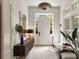 Bright foyer with stylish décor, including a wooden console, mirror art, and views of the front door at 429 Venning St, Mount Pleasant, SC 29464