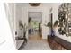 Elegant foyer featuring wood floors, a decorative mirror, stylish console table, and views into the home at 429 Venning St, Mount Pleasant, SC 29464