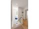 Well-lit hallway with hardwood floors and white trim, leading to various rooms in the home at 429 Venning St, Mount Pleasant, SC 29464