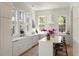 Bright, modern kitchen featuring white cabinetry, quartz countertops, and lots of natural light at 429 Venning St, Mount Pleasant, SC 29464