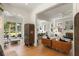 Open-concept living room with hardwood floors and seamlessly connected to a modern white kitchen at 429 Venning St, Mount Pleasant, SC 29464