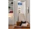 Bright and airy staircase leading to the upper level, featuring a built-in bookshelf and modern design at 429 Venning St, Mount Pleasant, SC 29464