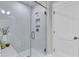 Modern bathroom featuring walk-in glass shower with white tile, built-in niche, and a sleek design at 4587 Summey St, North Charleston, SC 29405
