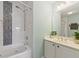 Bathroom features a soaking tub, tiled walls, and vanity with double sinks at 4765 Arco Ln, North Charleston, SC 29418