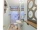Bathroom featuring a pedestal sink, towel racks and shelf, and blue and white shower curtain at 4765 Arco Ln, North Charleston, SC 29418