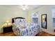 Bedroom features a queen-size bed with seahorse-themed bedding and wood floors at 4765 Arco Ln, North Charleston, SC 29418