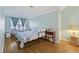 Bedroom featuring a full size bed and blue walls, and light-colored hardwood floors at 4765 Arco Ln, North Charleston, SC 29418