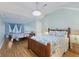 Shared bedroom features a queen bed, full size bed, ceiling fan, and light blue walls at 4765 Arco Ln, North Charleston, SC 29418