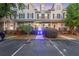 Charming townhome features a traditional facade, well-manicured landscaping, and ample parking at 4765 Arco Ln, North Charleston, SC 29418