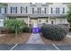Charming townhouse with inviting front porch, walkway, and landscaped yard at 4765 Arco Ln, North Charleston, SC 29418