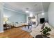 Inviting living room boasts hardwood floors, plenty of seating, and access to a patio with sliding glass doors at 4765 Arco Ln, North Charleston, SC 29418