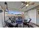 Relax on this covered deck with nice views, a ceiling fan, and seating at 4765 Arco Ln, North Charleston, SC 29418