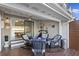 Cozy covered patio features a dining area and lounge seating, perfect for relaxing and entertaining at 4765 Arco Ln, North Charleston, SC 29418