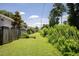 Photo shows backyard's long green space, surrounded by privacy fences and lush greenery at 507 Stinson Dr # E8, Charleston, SC 29407