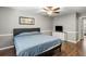This bedroom features a ceiling fan, a TV, a dresser, and wood floors at 507 Stinson Dr # E8, Charleston, SC 29407