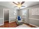 Comfortable bedroom showcasing a cozy armchair with a soft throw and a bright window with natural light at 507 Stinson Dr # E8, Charleston, SC 29407