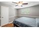 Cozy bedroom features a ceiling fan and a sunny window, creating a bright and airy space at 507 Stinson Dr # E8, Charleston, SC 29407