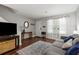 Bright living room featuring hardwood floors, neutral walls, and large window allowing natural light, creating an airy space at 507 Stinson Dr # E8, Charleston, SC 29407
