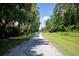 Street in a charming neighborhood, with mature trees lining the sidewalks, offering a peaceful setting at 507 Stinson Dr # E8, Charleston, SC 29407