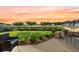 Cozy backyard patio with a manicured lawn and serene view of the neighborhood pond at 529 Dunswell Dr, Summerville, SC 29486