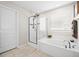 Bright bathroom features a glass shower, soaking tub, and neutral tile flooring at 529 Dunswell Dr, Summerville, SC 29486