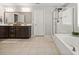 Bright bathroom featuring a shower, bathtub, vanity with dual sinks and tiled floor at 529 Dunswell Dr, Summerville, SC 29486
