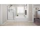 Bright bathroom showcasing a standalone shower and large bathtub with tile flooring at 529 Dunswell Dr, Summerville, SC 29486