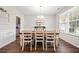 Cozy dining area with a farmhouse table, charming decor, and plenty of natural light at 529 Dunswell Dr, Summerville, SC 29486