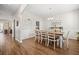 Bright dining room with a farmhouse-style table, white chairs, and elegant decor at 529 Dunswell Dr, Summerville, SC 29486