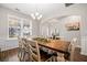 Airy dining room showcasing a large wooden table, comfortable seating, and a bright window at 529 Dunswell Dr, Summerville, SC 29486