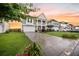 A beautiful two-story home showcasing a well-manicured lawn and a spacious driveway at 529 Dunswell Dr, Summerville, SC 29486