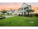 Lovely two-story home with manicured lawn and inviting front porch, set within a peaceful neighborhood at 529 Dunswell Dr, Summerville, SC 29486