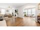 Open-concept living room features hardwood floors, a fireplace, and an open archway to a sunroom at 529 Dunswell Dr, Summerville, SC 29486