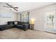 Living room features a gray sectional couch, ceiling fan and a door with a view at 529 Dunswell Dr, Summerville, SC 29486