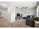 Carpeted living room with a sectional couch, ceiling fan, TV, and beach-themed art at 529 Dunswell Dr, Summerville, SC 29486