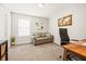 Home office with a sofa, desk, and a wooden world map on the wall at 529 Dunswell Dr, Summerville, SC 29486