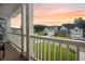 Relaxing porch with serene views of the neighborhood with sunrise hues at 529 Dunswell Dr, Summerville, SC 29486