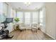 Bright sunroom with lots of windows, neutral walls, and wood-look flooring at 529 Dunswell Dr, Summerville, SC 29486