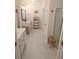 Spacious bathroom featuring double vanity sinks, tile floors, storage, and a glass-enclosed shower at 558 Pendleton Dr, Moncks Corner, SC 29461