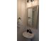 Elegant half-bathroom with a pedestal sink, decorative mirror, and stylish lighting at 558 Pendleton Dr, Moncks Corner, SC 29461