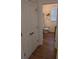 Stylish half-bathroom featuring hardwood floors, a toilet, and decorative wall accents at 558 Pendleton Dr, Moncks Corner, SC 29461