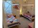 ' bedroom with two beds, colorful bedding, and plenty of natural light at 558 Pendleton Dr, Moncks Corner, SC 29461