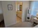 Bedroom featuring neutral carpet, view into the bathroom, and white trim at 558 Pendleton Dr, Moncks Corner, SC 29461