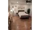A luxurious bedroom featuring hardwood floors, decor and a comfortable bed at 558 Pendleton Dr, Moncks Corner, SC 29461