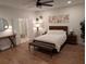 A bedroom featuring hardwood floors, bright lights, decor and a comfortable bed at 558 Pendleton Dr, Moncks Corner, SC 29461