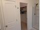 View of a walk-in closet with wooden shelving and ample storage space near the bathroom at 558 Pendleton Dr, Moncks Corner, SC 29461