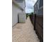 Side yard with stone ground cover, fence, storage shed, and AC Units at 558 Pendleton Dr, Moncks Corner, SC 29461