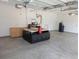 Spacious garage with white walls, concrete floors, and CNC machinery at 558 Pendleton Dr, Moncks Corner, SC 29461