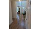Hallway showcasing the hardwood floors, high ceiling and lots of light at 558 Pendleton Dr, Moncks Corner, SC 29461
