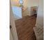 Hallway featuring wood floors, white walls, with access to office nook and carpeted area at 558 Pendleton Dr, Moncks Corner, SC 29461